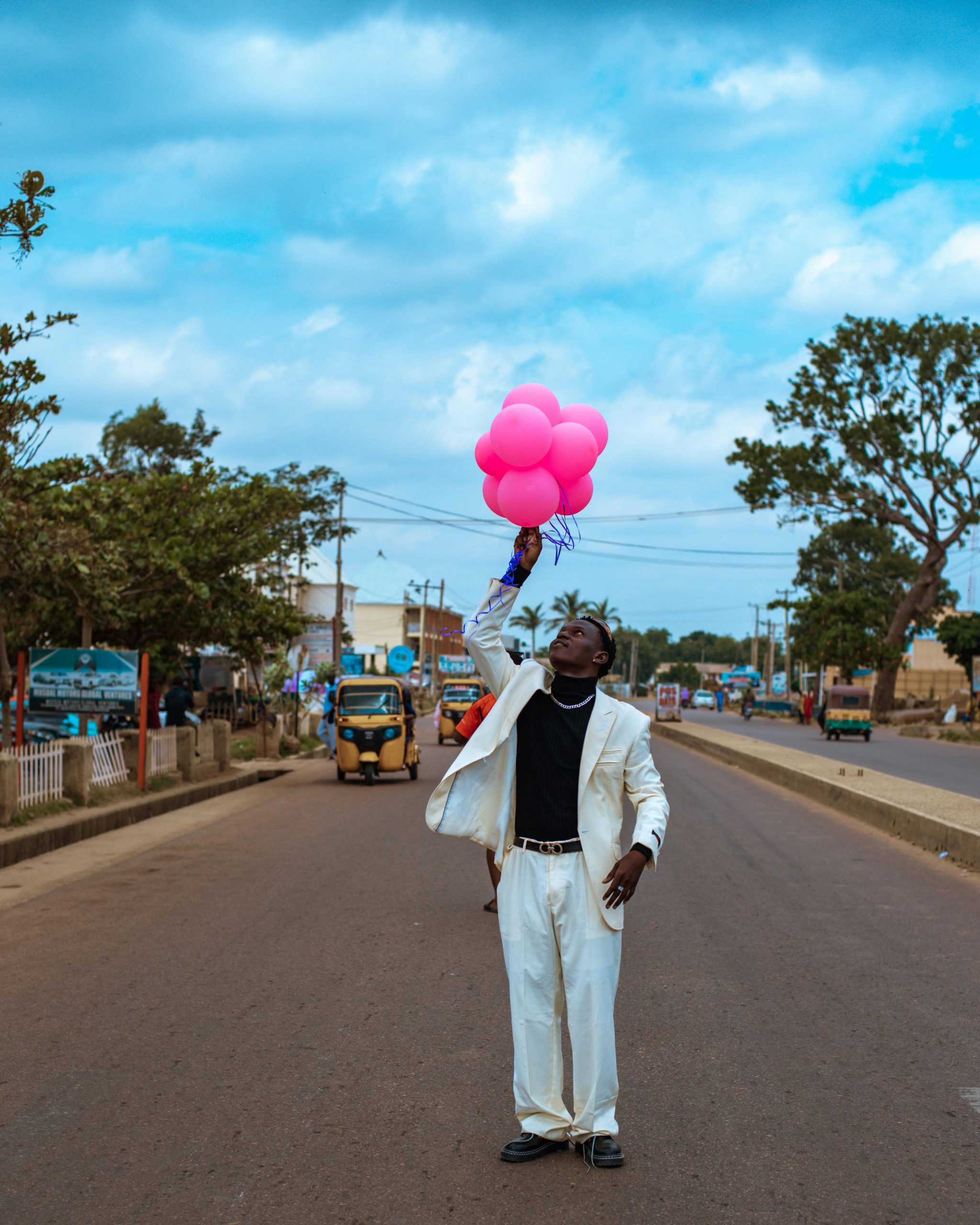 Bloke sat doing NOS balloons all day across the road